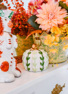 A green leaf ceramic pumpkin from For Pete's Sake adds a pretty fall touch to this mantel