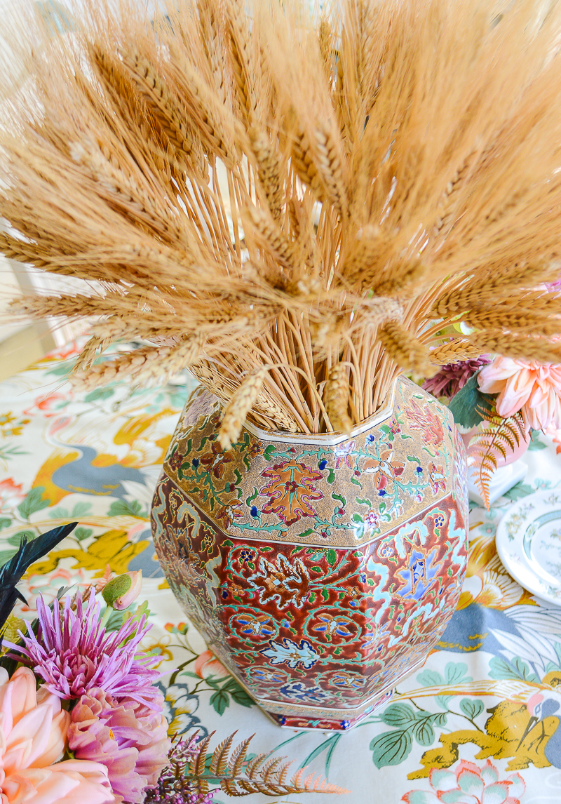 Middle Eastern inspired enameled vase filled with dried wheat makes a beautiful fall centerpiece