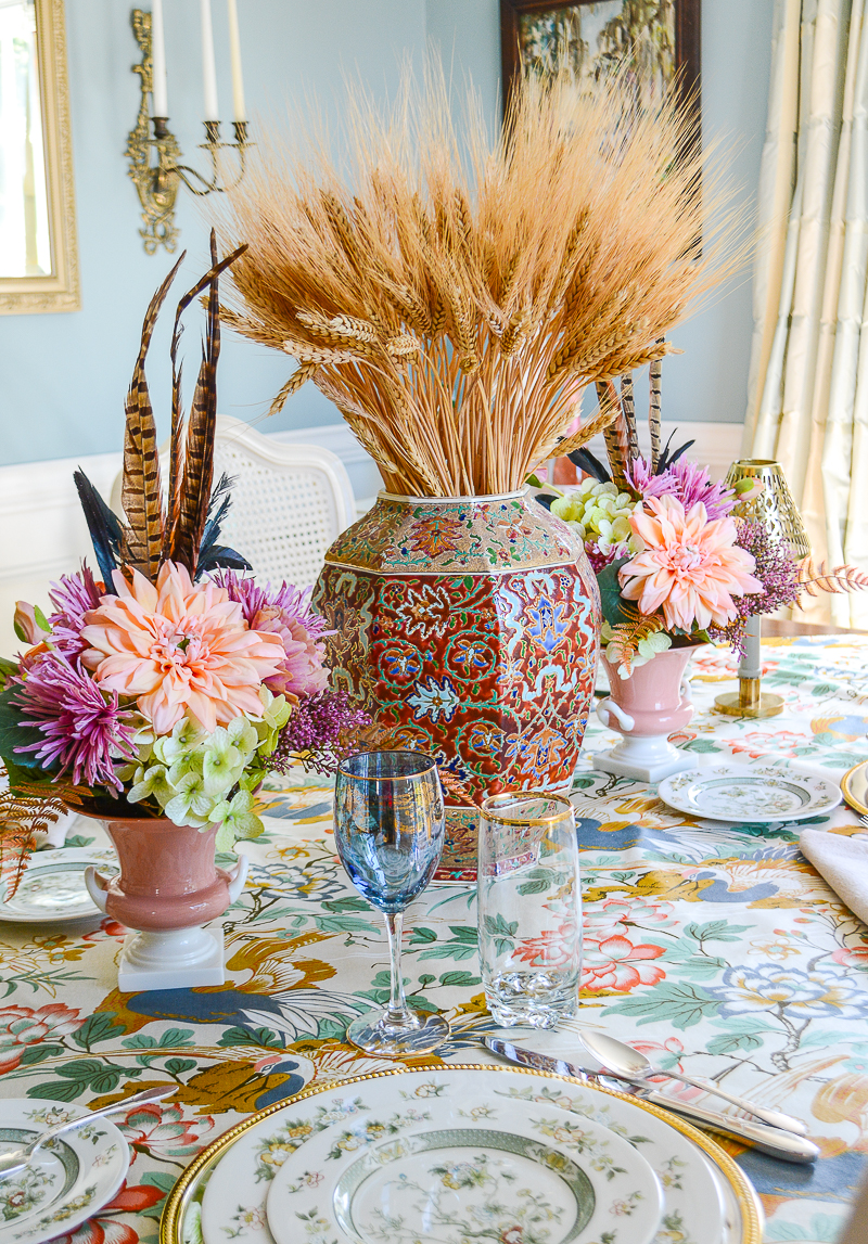 Middle Eastern inspired enameled vase filled with dried wheat makes a beautiful fall centerpiece