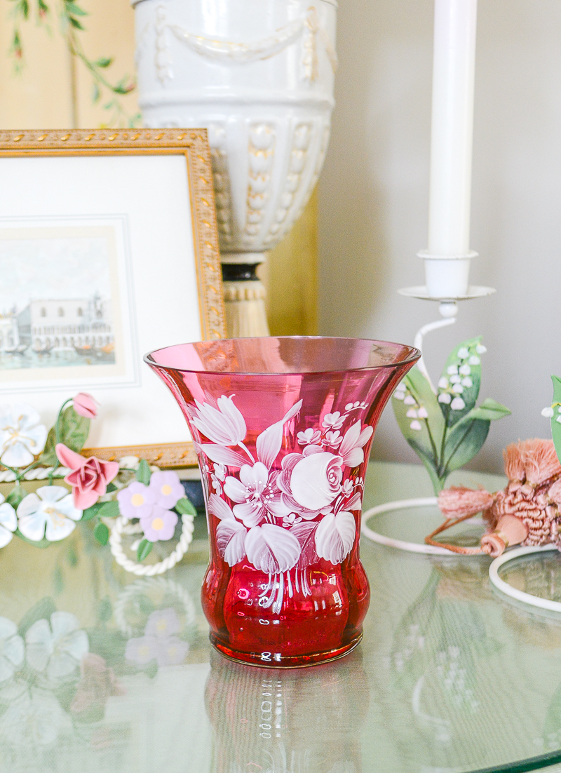 cranberry glass vase with enameled white florals