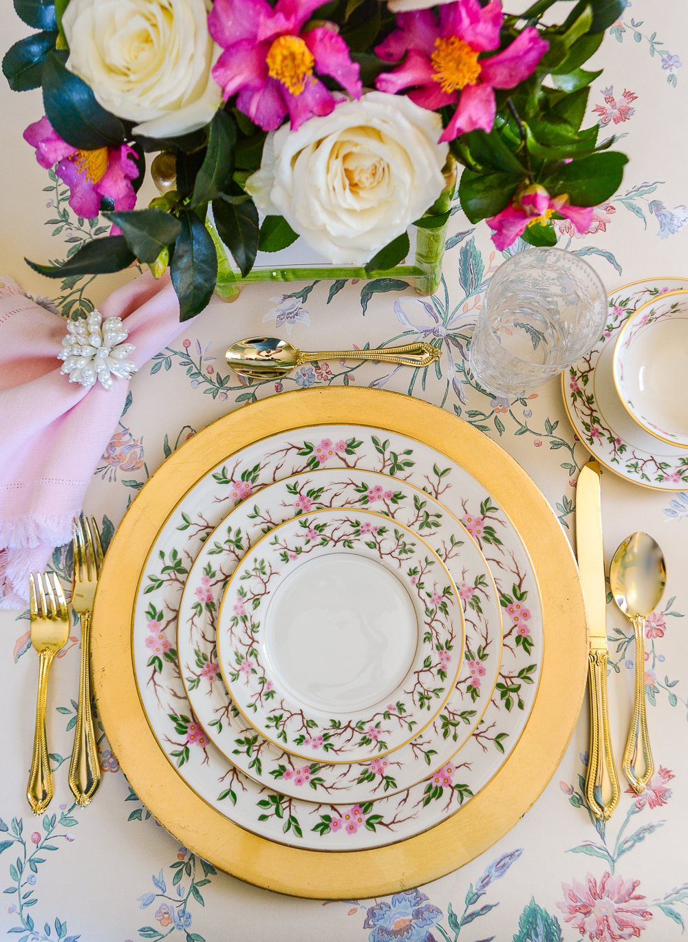 Pink camellias and white roses perfectly set off this Franciscan woodside china for a celebratory dinner.