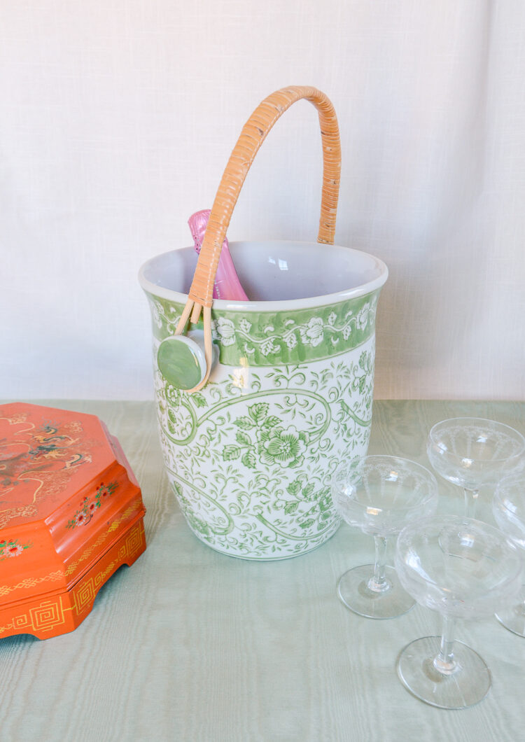 Shop this large ceramic cooler with wicker handle in green and white florals on Curio Collected.
