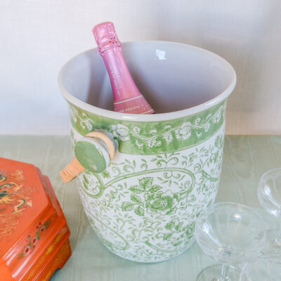Shop this large ceramic cooler with wicker handle in green and white florals on Curio Collected.