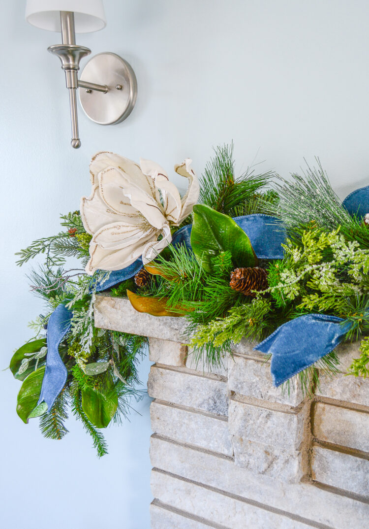 Shop this frosted garland featuring a wintery iced mix of pine, cedar, juniper, and magnolia. It is perfect for the mantel or stairs.