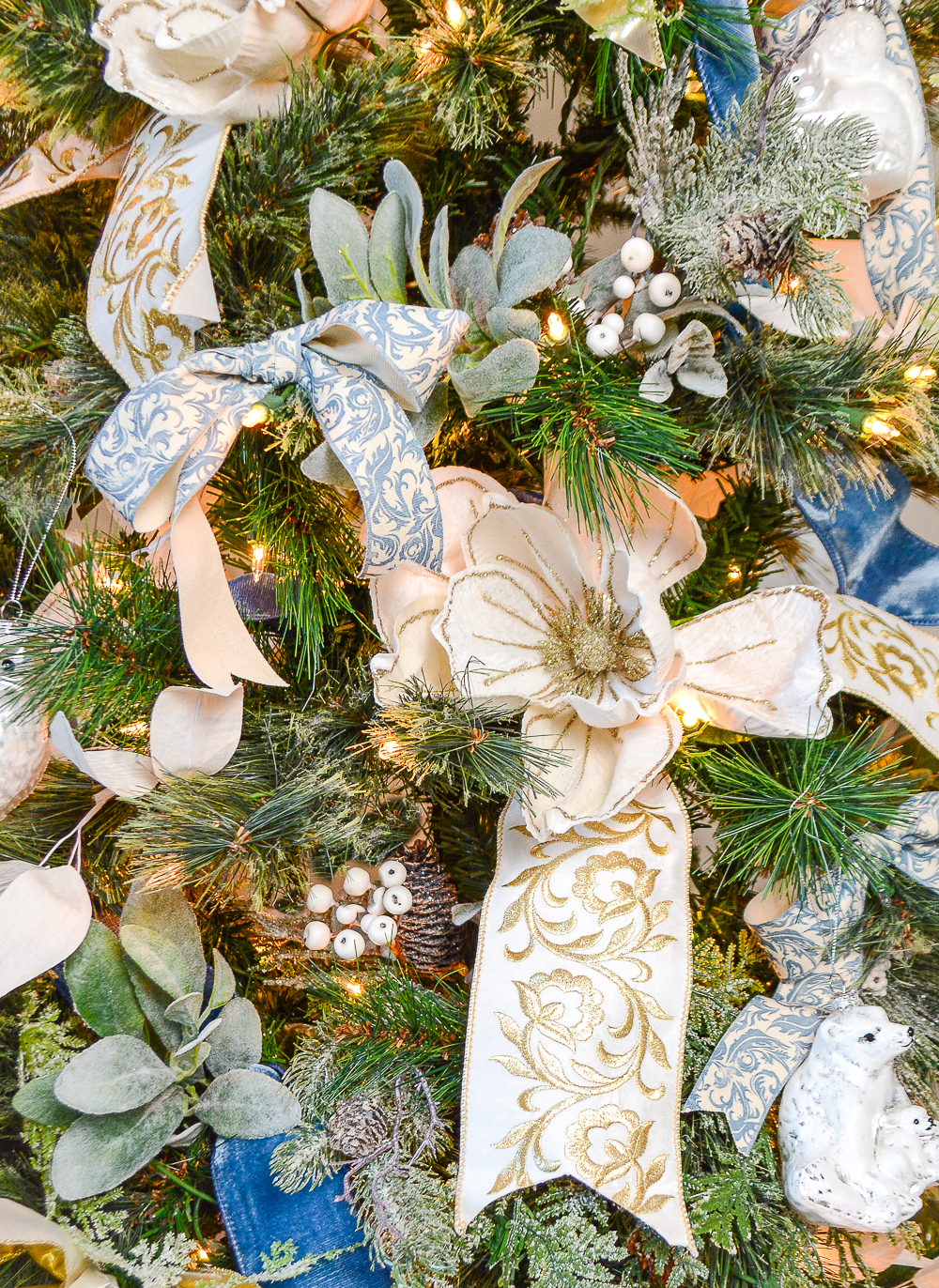 A gorgeous lusly decorated Christmas tree in blue and white from the Frosted Winter collection from Pender and Peony!