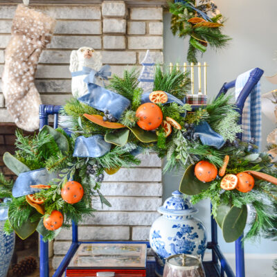Shop this Williamsburg inspired Christmas swag with blue velvet ribbon and orange pomanders on penderandpeony.com !