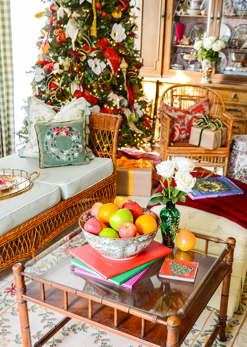 A Rose Medallion bowl filled with apples, pears, and oranges creates a colorful Williamsburg inspired look on the coffee table.