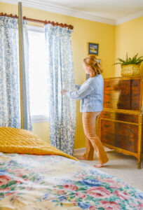 Katherine fixes Decoberry curtains in blue and white Emily leaf print in her newly renovated guest bedroom