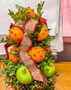 Ribbon tuft secured to fruit topiary