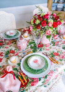 A pink, green, and red Valentine's Tablescape with Grandmillennial style and chintz linens