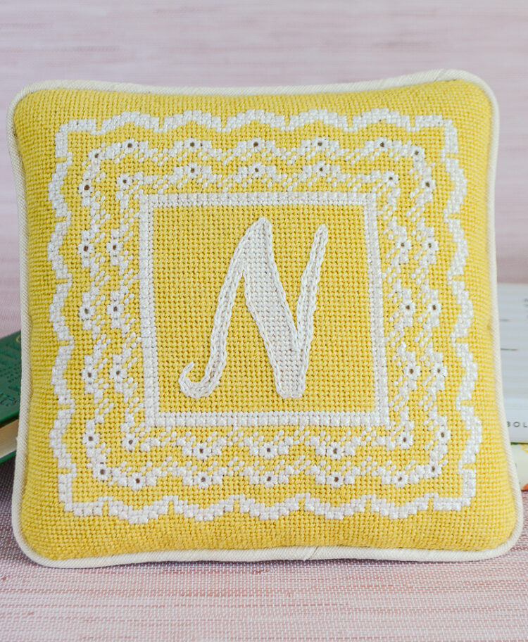 Yellow “N” Eyelet Needlepoint Pillow