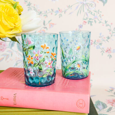 A beautifully painted pair of blue glass tumblers in an Art Nouveau or Bohemian style.