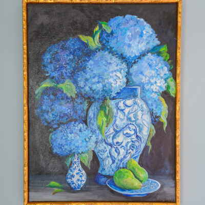 An absolutely stunning painting of hydrangeas in blue and white jars against a dark background with a plate of pears by TN artist Lydia Reynolds.