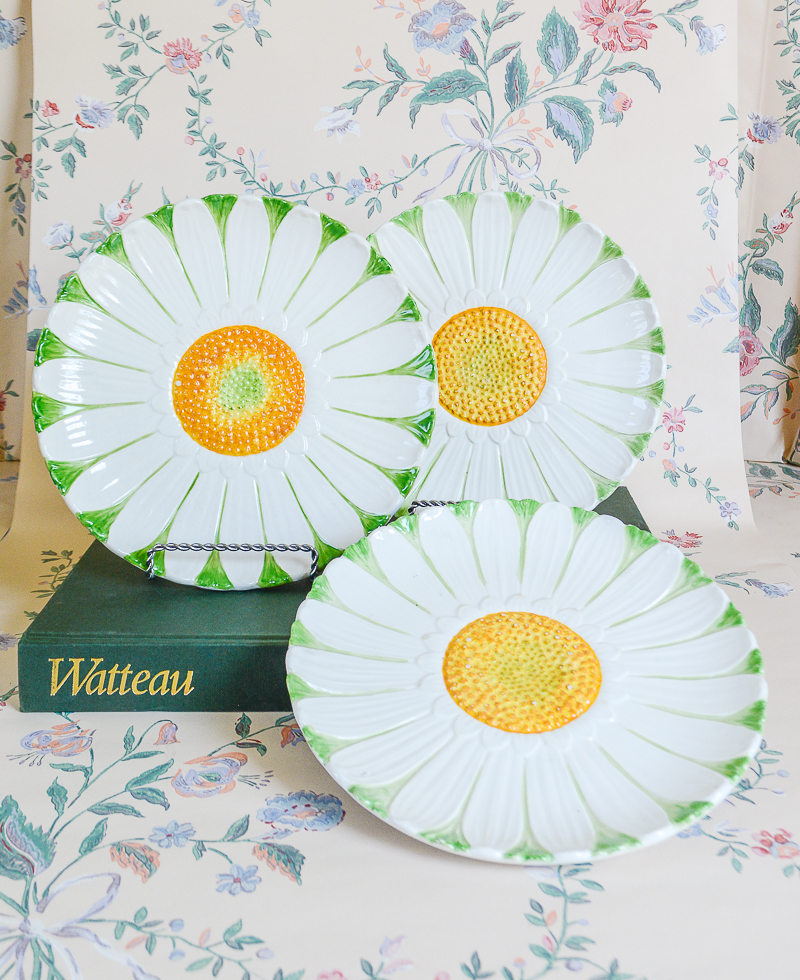 Shop these cheerful white, green, and yellow daisy plates on penderandpeony.com for a unique wall display.