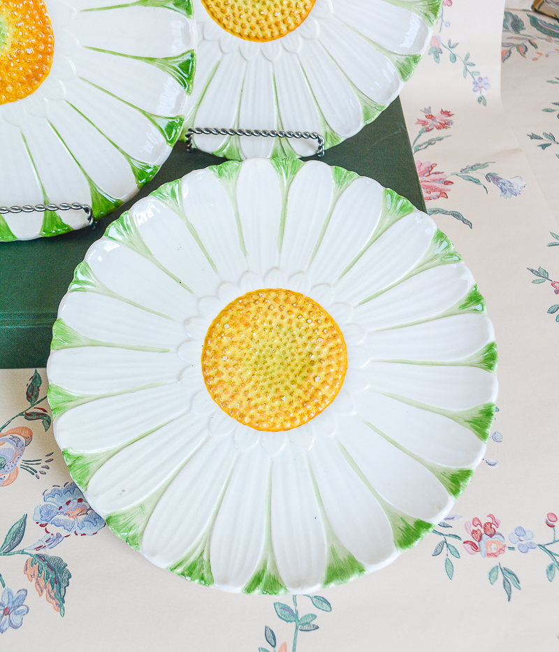 Shop these cheerful white, green, and yellow daisy plates on penderandpeony.com for a unique wall display.