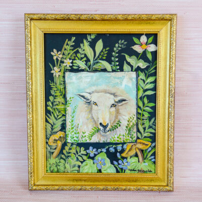 A wooly sheep casually munches on greens in this original painting by TN artist Lydia Reynolds. Shop now on penderandpeony.com