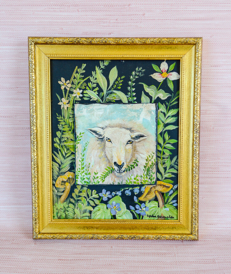 A wooly sheep casually munches on greens in this original painting by TN artist Lydia Reynolds. Shop now on penderandpeony.com