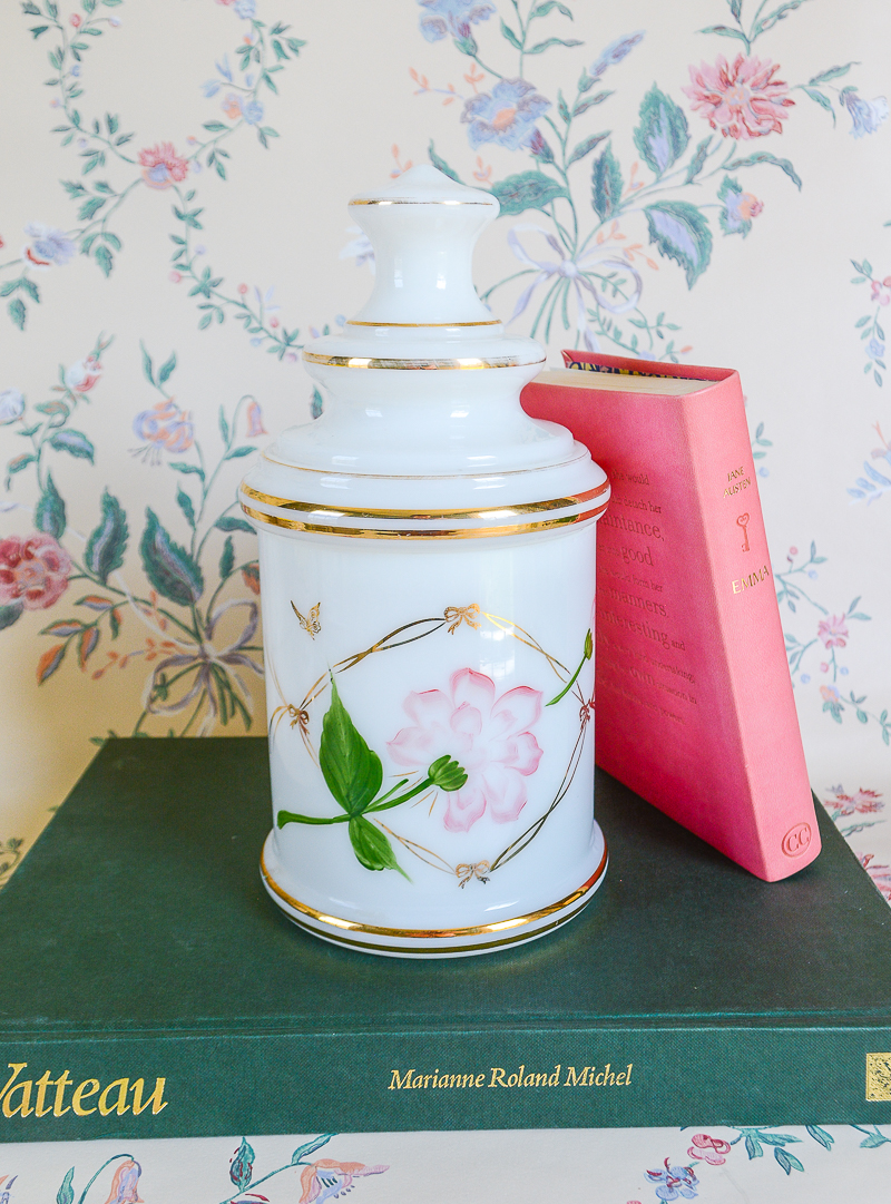 Shop this vintage apothecary jar in white satin glass with pink lotus design on Curio Collected at penderandpeony.com