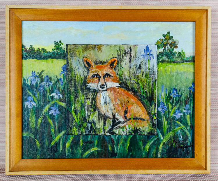 A charming painting of a bold little fox posed amongst a patch of iris by TN artist Lydia Reynolds.