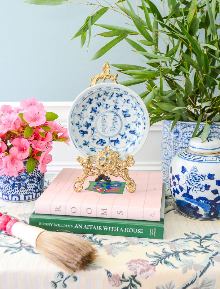 A useful little dish in blue and white with Chinese calligraphy medallion.