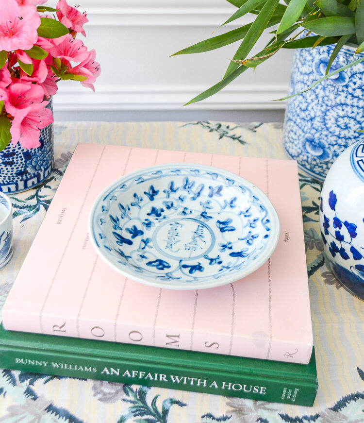 A useful little dish in blue and white with Chinese calligraphy medallion.