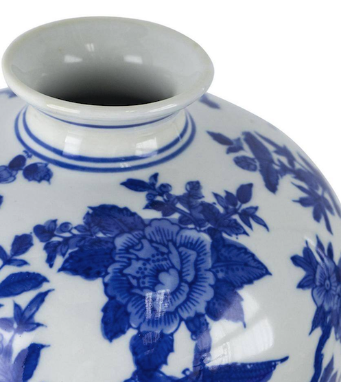 Detail of modern blue and white knock-off vase with poor quality decoration