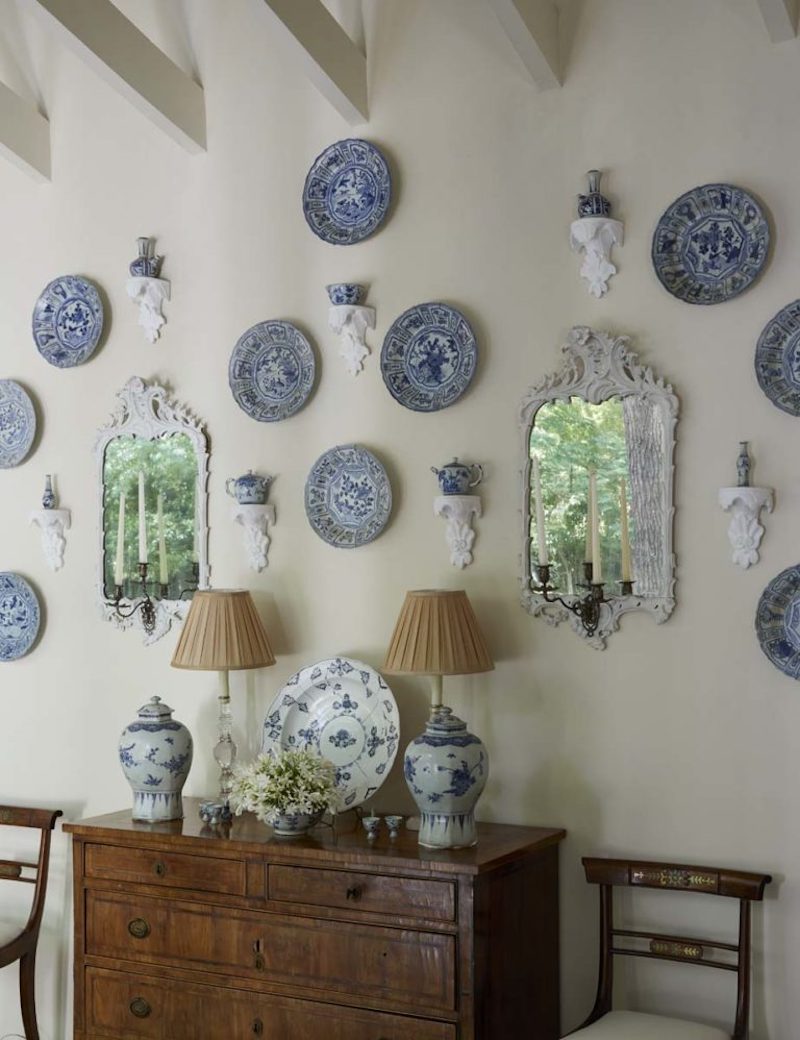 Wall of blue and white porcelains with mirrors and brackets