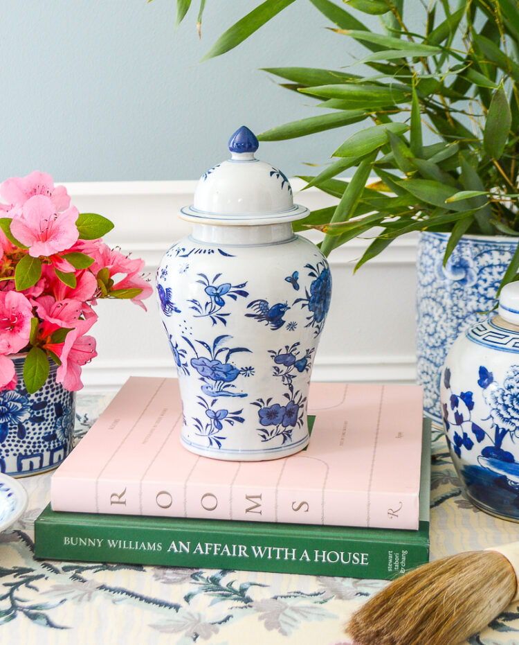 Small Chinese temple jar with blue and white floral designs.