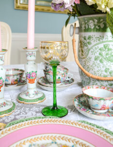 Gilt and crystal coupe with green stem and etched floral swag design