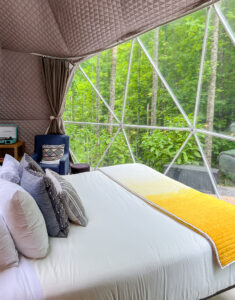 view from bed inside glamping dome