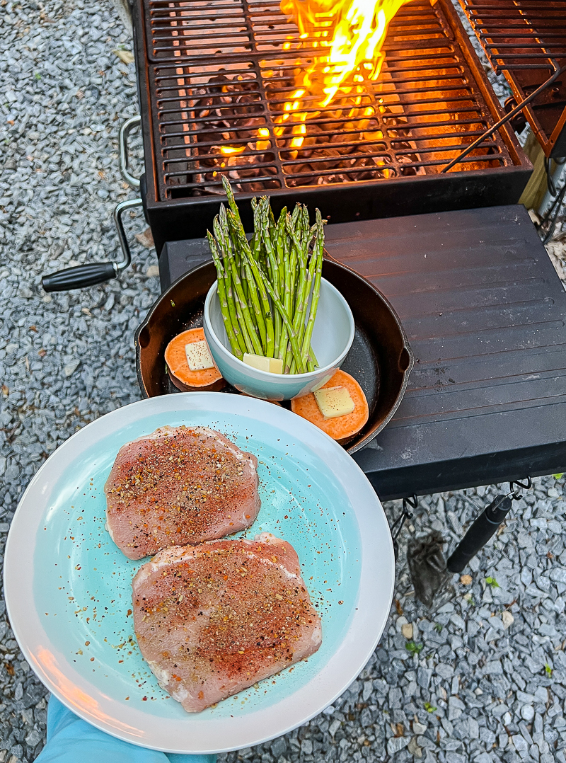 Pork chops, sweet potatoes, and asparagus going on the grill
