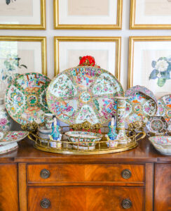 A stunning collection of antique Rose Medallion porcelains displayed on a sideboard