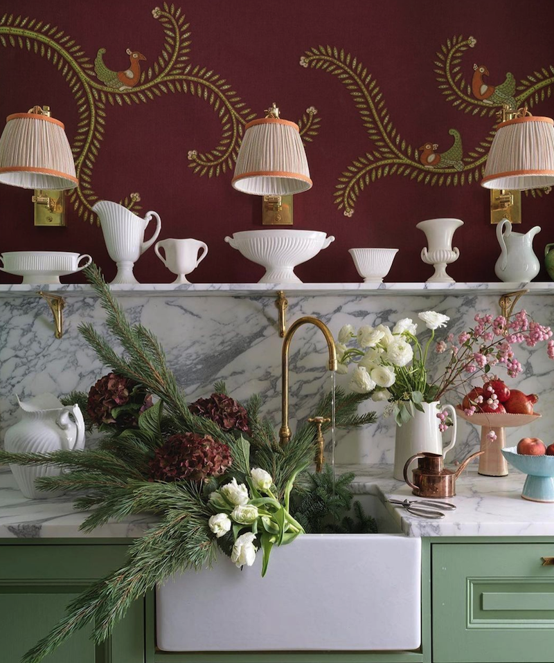 marble kitchen sink filled with pine and hydrangea for a lovely fall scene