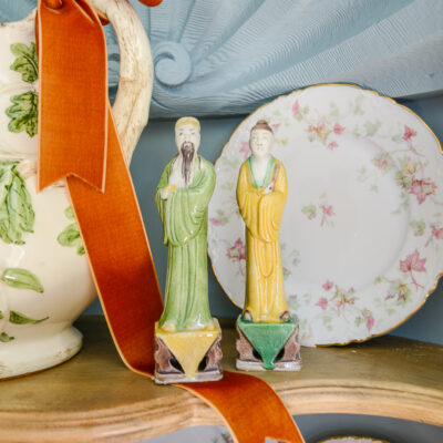 Yellow and green Chinese immortal statuettes