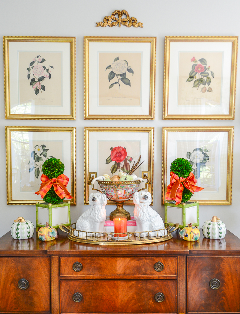 My mahogany sideboard with boxwood topiary, staffordshire spaniels, rose medallion, and pumpkins - fall living room decor