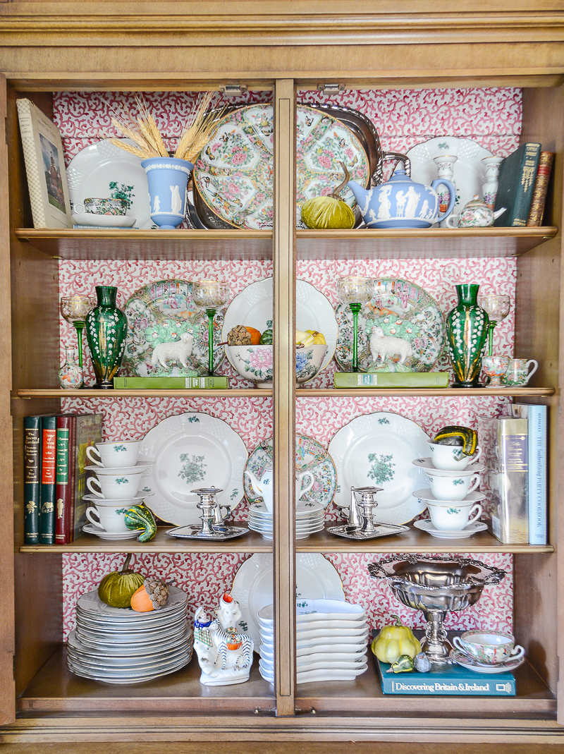 Little touches of fall decor with pumpkins in the china cabinet