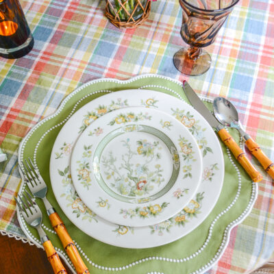 Chinoiserie fall table with Royal Doulton china, blue pagoda centerpiece, and dahlias on a plaid tablecloth