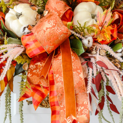 Step 7 to DIY my autumn sculptural garland - layered gingham and copper leaf bow with velvet streamers