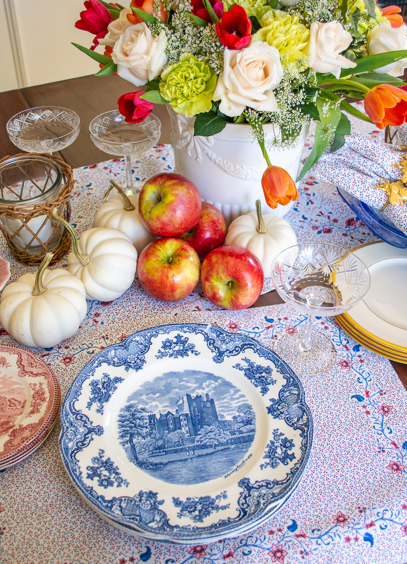 Blue and white transferware dishes on a fall table