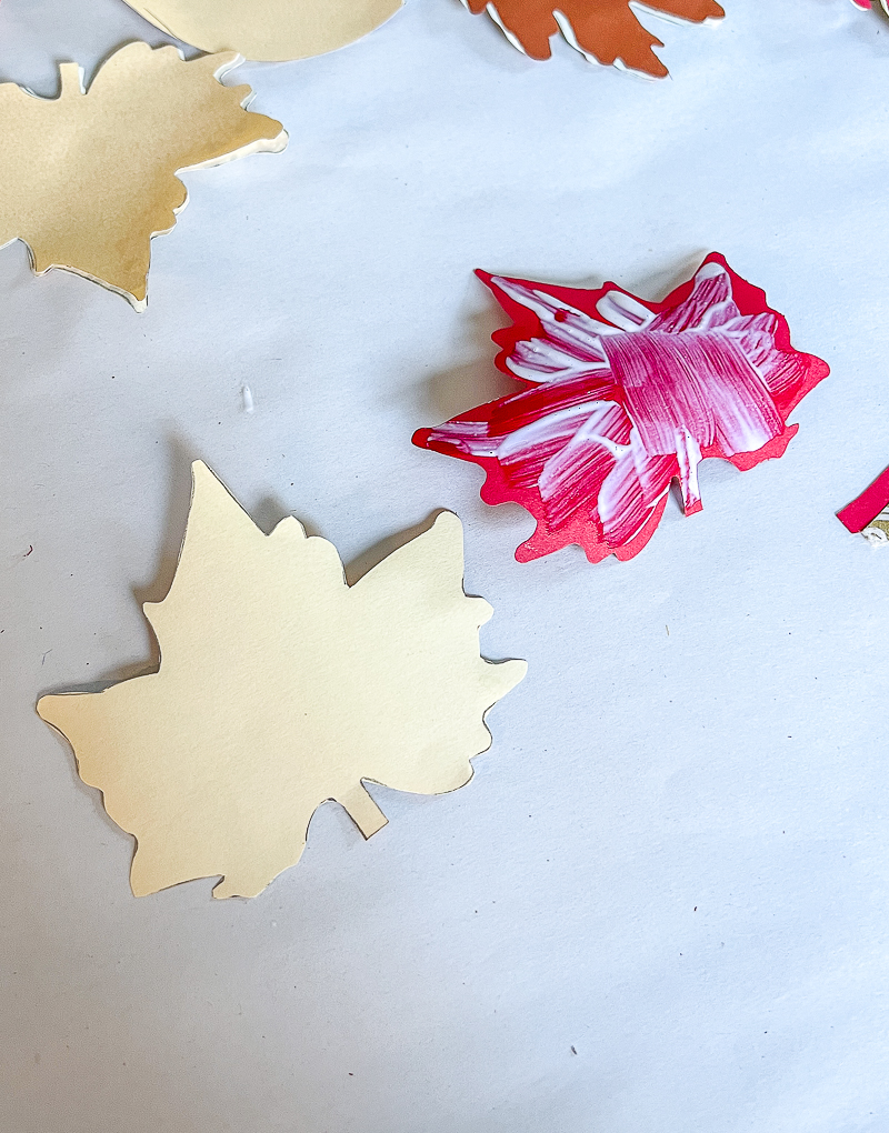 Brush Mod Podge on leaf backs to glue leaf template and special paper leaf together