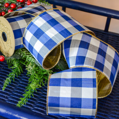 Shop this bright blue and white gingham ribbon with gold backing on penderandpeony.com