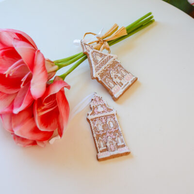 Love the look of gingerbread houses? Don’t want to craft your own? Add this pretty pair of ornaments to your tree! A festive look with out the hassle in pink icing.