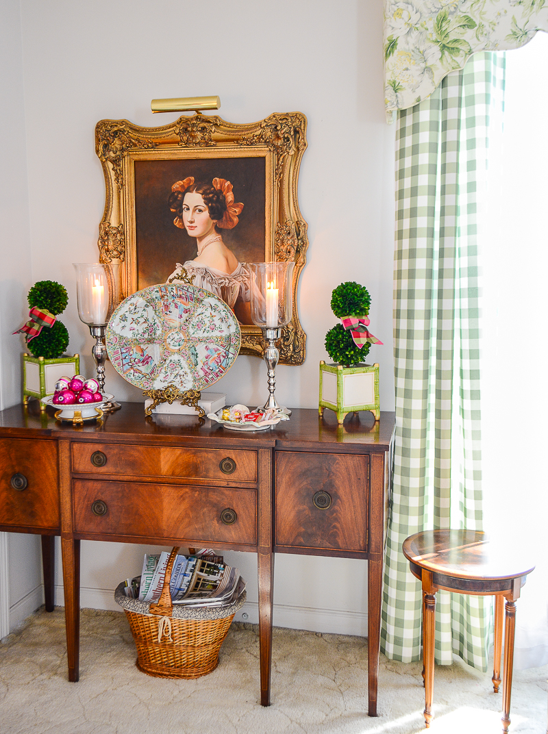 Styling the sideboard for Christmas with large Rose Medallion platter, boxwood topiary, and trays of vintage baubles