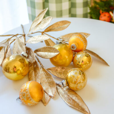A fun glittery grouping of Midcentury glass ornament balls with designs on the four smaller ones. 4 mica glitter, unmarked and 2 Shiny Brites. Shop on penderandpeony.com