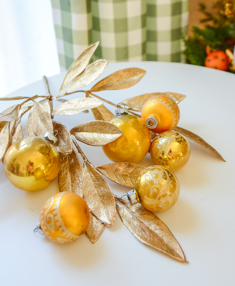 A fun glittery grouping of Midcentury glass ornament balls with designs on the four smaller ones. 4 mica glitter, unmarked and 2 Shiny Brites. Shop on penderandpeony.com