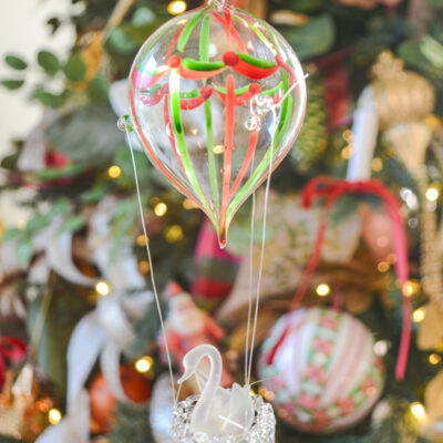 This blown glass ornament is a treasure. If you love hot air balloons and swans, snatch this one up quick. Vintage. Shop on penderandpeony.com