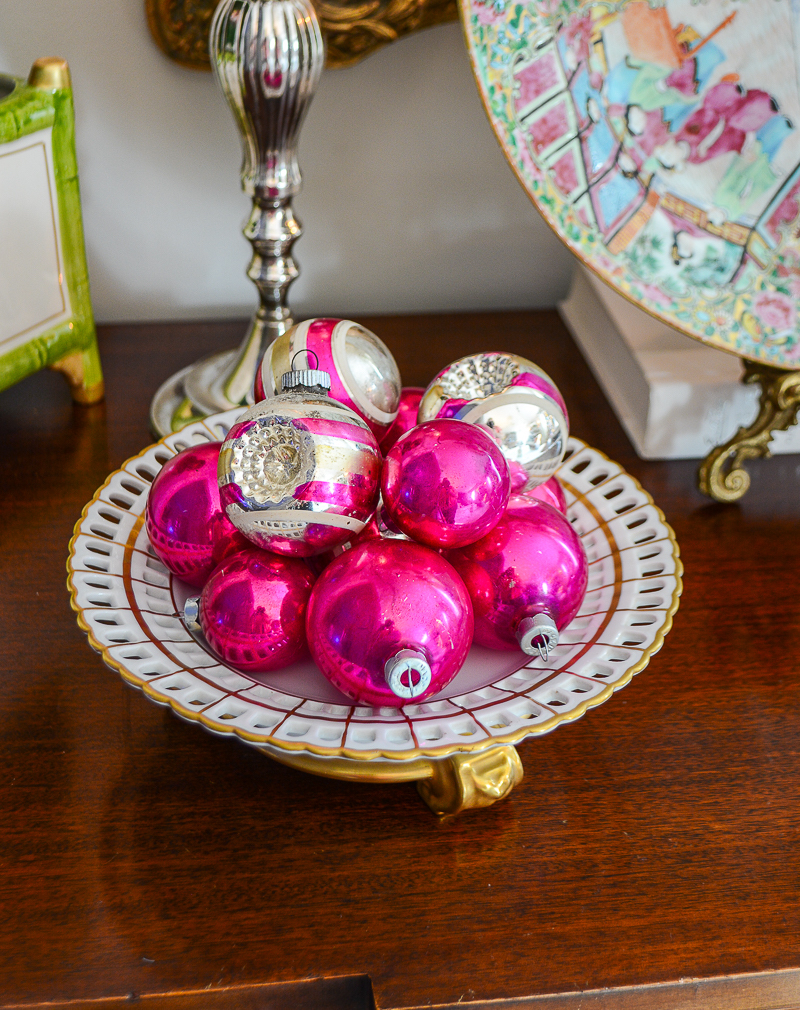Vintage pink baubles displayed on gold and white tazza