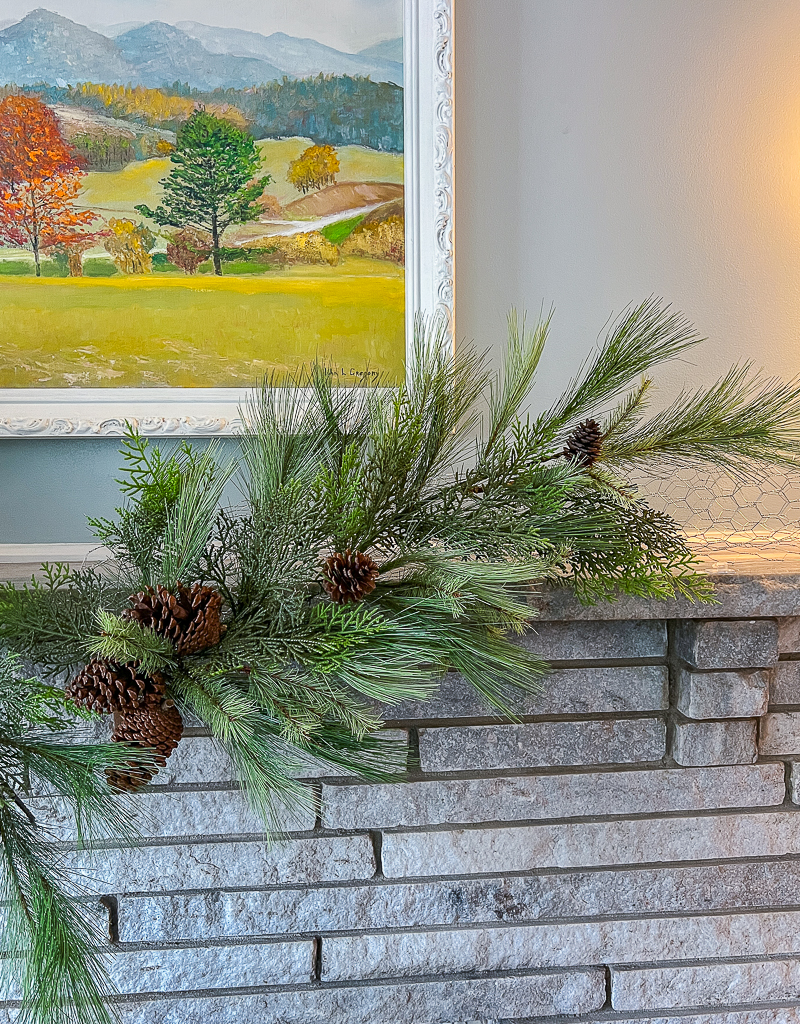 One small teardrop swag secured to right side of mantel chicken wire base