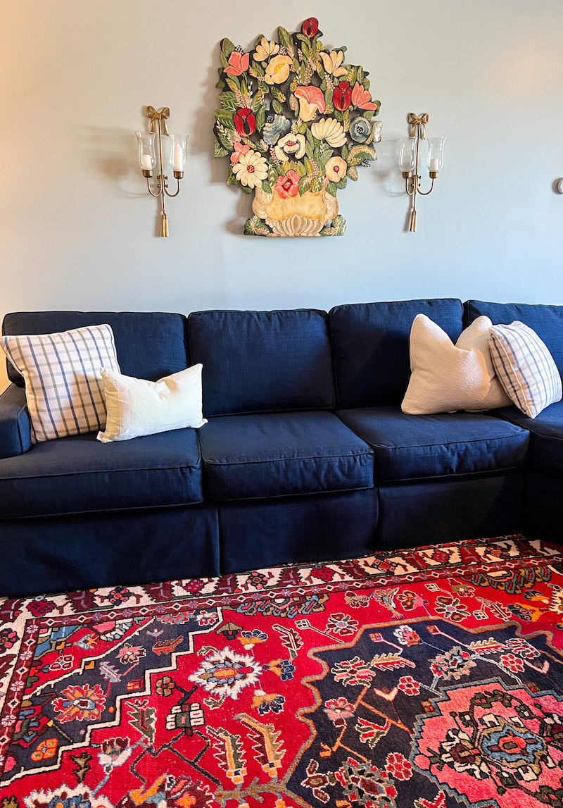 My Heriz rug in front of the navy sofa in my den after cleaning