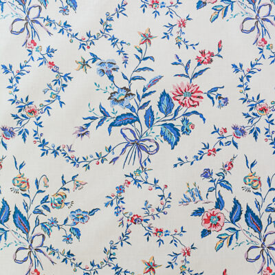 Nantucket Stroll vintage chintz fabric by Waverly for Schumacher featuring bouquets of flowers tied with bow and trailing vines